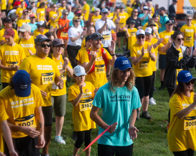 Memory walk & Jog. Group of people warming up before the race.